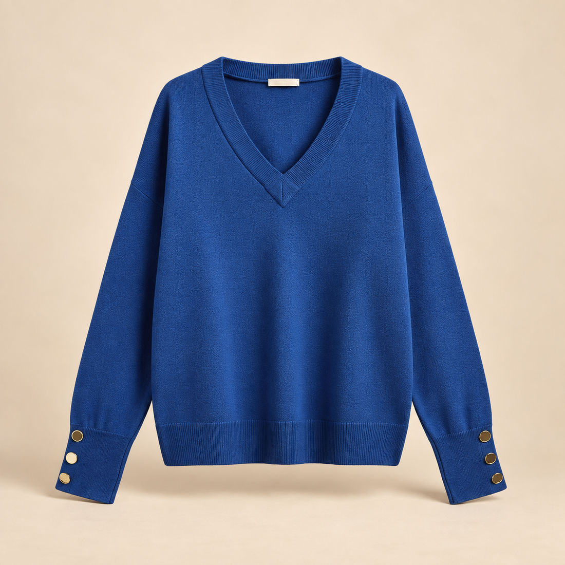 Sweter damski w serek z obniżoną linią ramion i mankietami na guziki