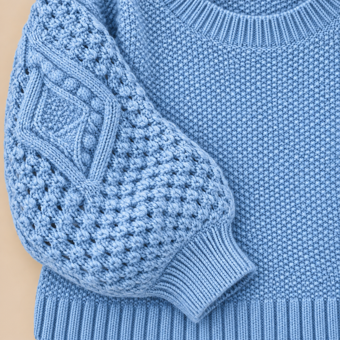 Sweter damski w warkocze z bufiastymi rękawami